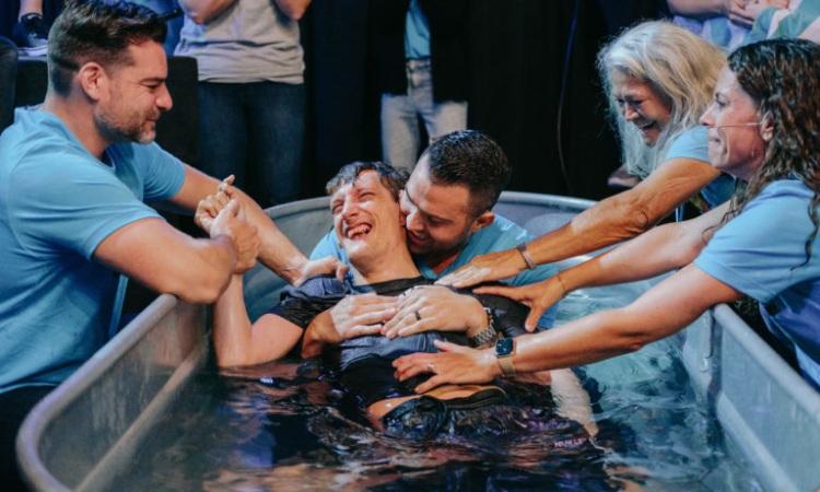 A joyful baptism with friends gathered around